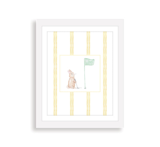 A framed watercolor art print of a golfing bunny rabbit with a striped background, presented in a white frame.