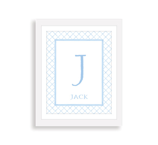 Framed print with a blue letter and name on a white background with a preppy blue pattern