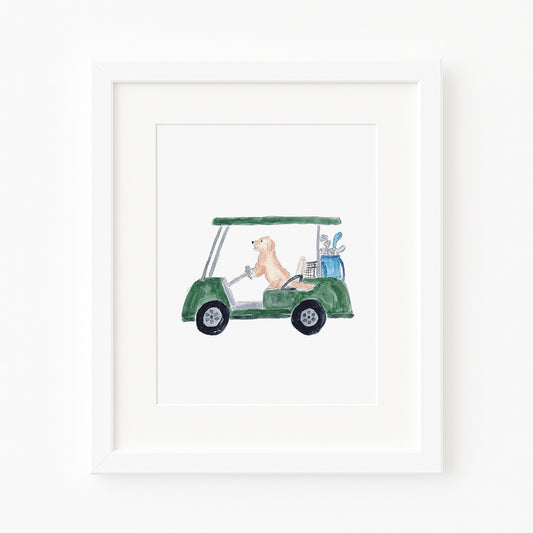 Framed artwork of a dog driving a golf cart with clubs on a white background